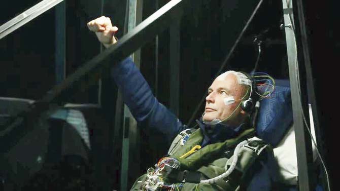 Bertrand Piccard gives a thumbs-up from the cockpit before landing in Ahmedabad