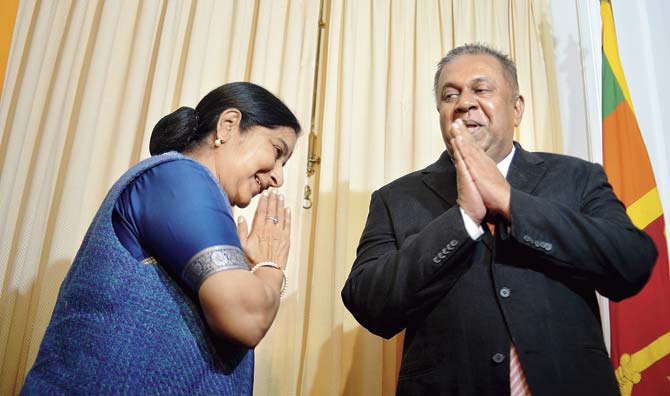 Indian Foreign Minister Sushma Swaraj and Sri Lankan Foreign Minister Mangala Samaraweera greet each other in Colombo, ahead of Prime Minister Narendra Modi’s visit to Sri Lanka on March 13-14. Pic/AFP