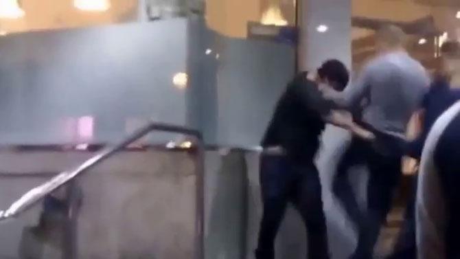 A video grab showing a Britisher beating a Sikh man