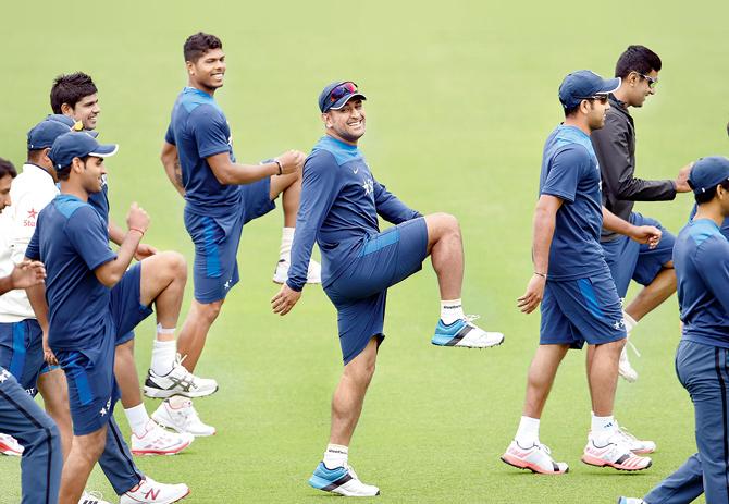 MS Dhoni shares a light moment with teammates during a team training session at the Sydney Cricket Ground (SCG) on January 5