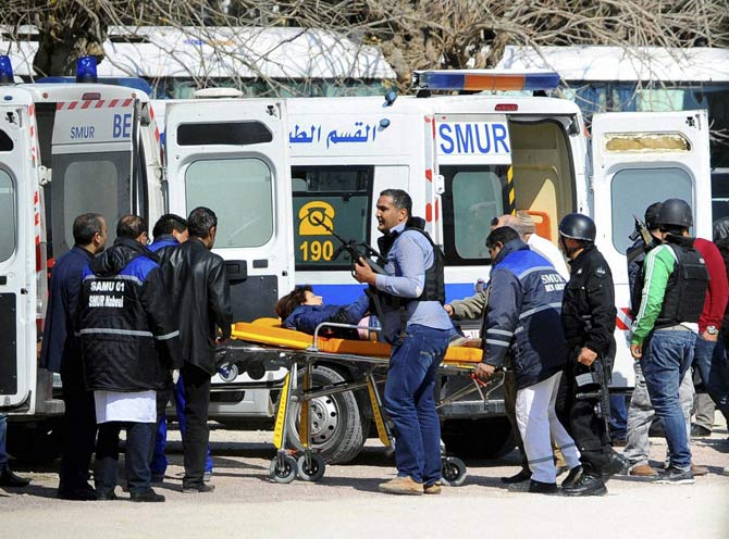 A victim is being evacuated by rescue workers outside the Bardo musum in Tunis, Wednesday, March 18, 2015 in Tunis, Tunisia. 