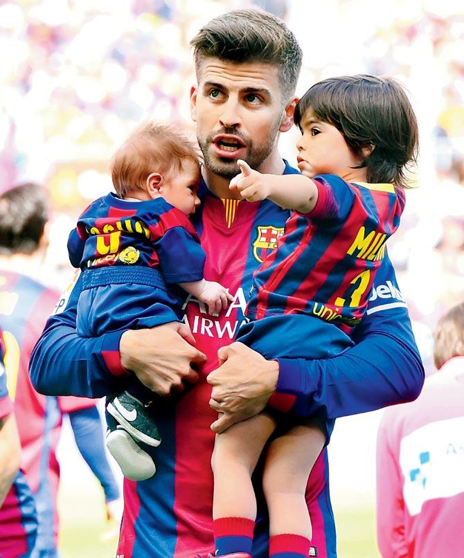 FC Barcelona’s Gerard Pique with his sons Sasha (left) and Milan