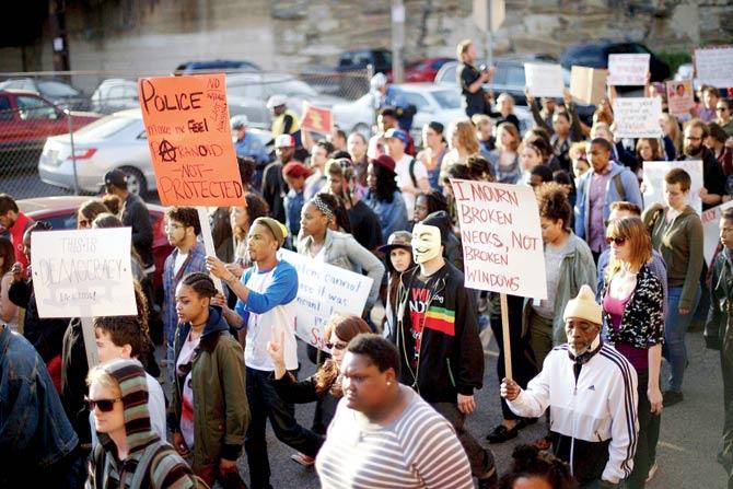 Citizens march in Philadelphia to protest the custodial death of Freddy Gray. He was arrested for possessing a switch blade knife and  died a week later from a severe spinal cord injury allegedly received due to police negligence. Pic/AFP