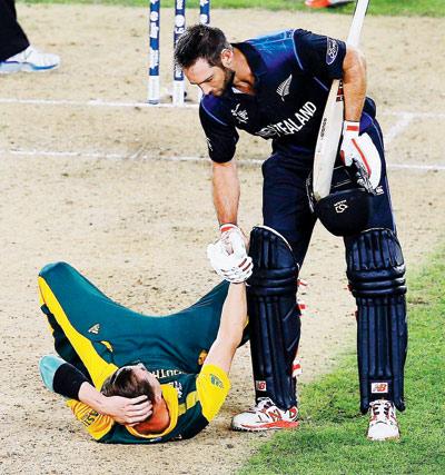 New Zealand’s Grant Elliott picks up a disappointed Dale Steyn after guiding his side to a 2015 World Cup semi-final win over South Africa at Eden Park in Auckland on March 24. PIC/Getty Images