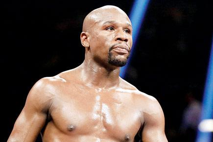 Mayweather calls Pacquiao a coward, backs out of rematch