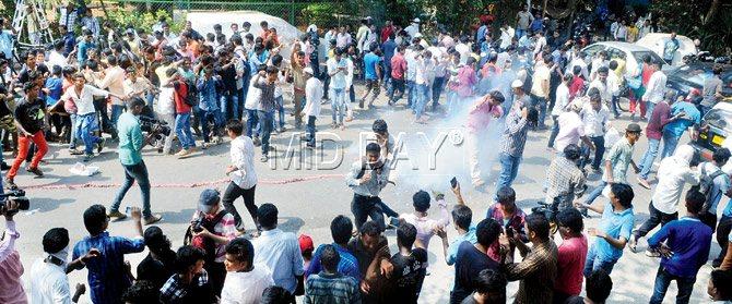 (Above) Fans burst crackers to celebrate suspension of Salman’s five-year prison term and (top right) the crowd waves at Salman. Pics/Nimesh Dave