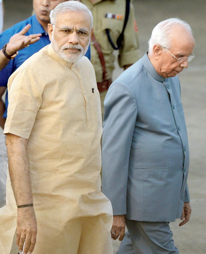 BENGAL BOUND: Narendra Modi (l) is escorted by West Bengal Governor Keshari Nath Tripathi at the airport during his two-day official trip to the state. PICS/AFP