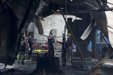 Kin says workers were trapped as Philippines factory fire kills 58