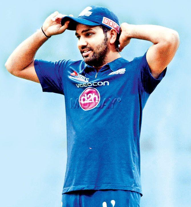 Dump it here: Mumbai Indians captain Rohit Sharma during a training session at Wankhede Stadium yesterday ahead of today