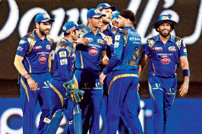 Mumbai Indians players celebrate the wicket of Kolkata Knight Riders’ Manish Pandey at Wankhede on Thursday