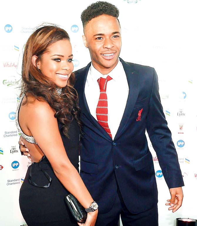 Raheem Sterling arrives for the Liverpool 2015 Players’ Awards at the Echo Arena in Liverpool with a female friend. Pic/AFP