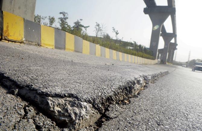 The cracks on the road surrounding the piers make this stretch extremely dangerous for motorists. File pic