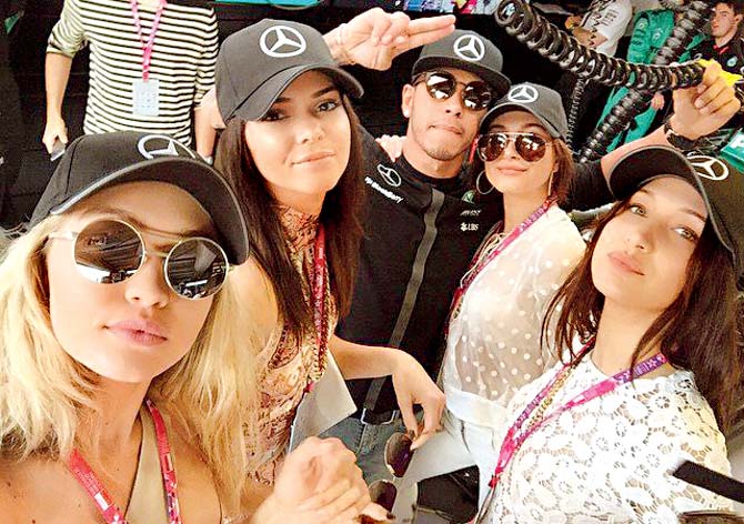Gigi Hadid (first from left) posted this picture on Instagram as she and her friends posed with Lewis Hamilton at the Monaco GP