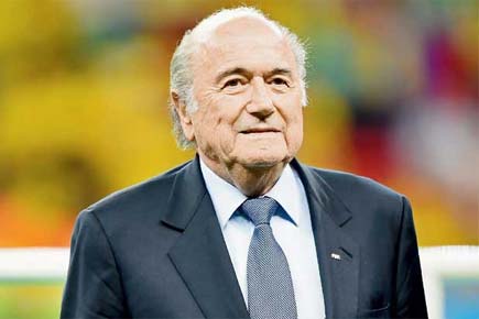 Calls for FIFA president Sepp Blatter to quit as global anger builds