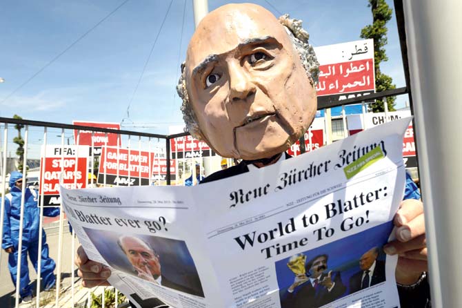 A demonstrator disguised as FIFA president Sepp Blatter takes part in a protest against the condition of workers in Qatar, on the sidelines of the 65th FIFA Congress yesterday in Zurich. Pic/AFP