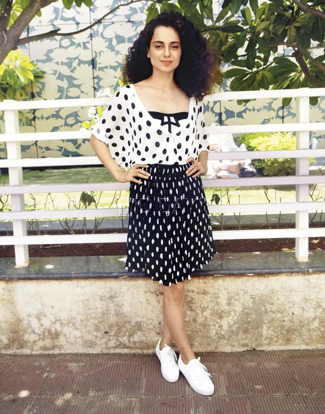 Kangana Ranaut goes for school-girl pretty with monochrome polka dots and sneakers for the girl-on-the-run look. Pic/Pradeep Dhivar
