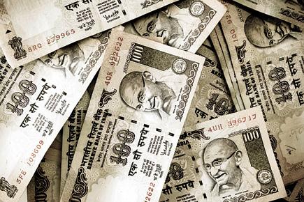 Rupee gains 11 paise against dollar