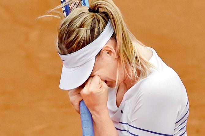 Maria Sharapova gets emotional after her win over Samantha Stosur on Friday. Pic/AFP