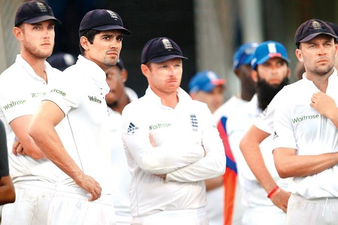 England skipper Alastair Cook (second from left) is dejected after his team’s loss to WI. Pic/Getty Images
