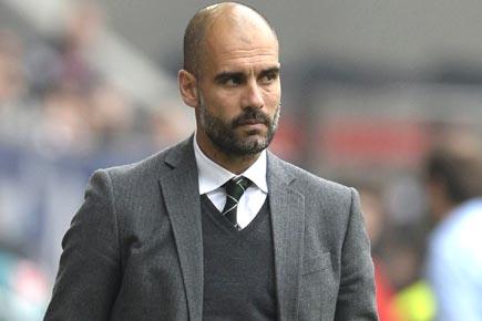 No special welcome for returning hero Guardiola: Barca president