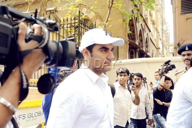 A cameraman follows Bollywood actor and filmmaker Arbaaz Khan, Salman’s younger brother, outside the court yesterday