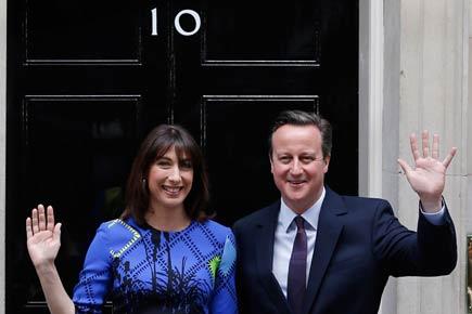 David Cameron's Conservatives defy forecasts, win British polls