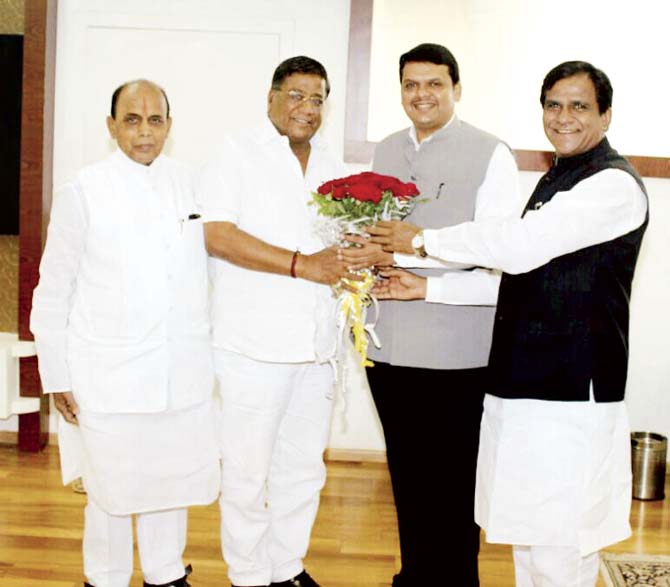 Omprakash Pokarna (second from left) is welcomed into the BJP fold by CM Devendra Fadnavis and state BJP president Raosaheb Danve Patil in the presence of Bhaskar Khatgaonkar (extreme left). Pokarna said the Congress wanted him to appease Muslims
