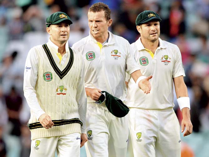 In this file photo, Australian fast bowler Peter Siddle (centre) appears frustrated as he walks off the field with captain Michael Clarke (left) and fellow pacer Ryan Harris during the Oval Test against England in London on August 22, 2013. Pic/Getty Images