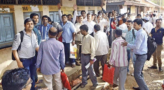 People wait outside the Tardeo RTO. Chaos and confusion normally reign at these transport offices. File pic
