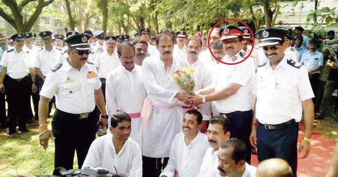 Sunil Nesarikar (circled) said the clothes given by the BMC could never withstand fires, shrank after one wash and were made of poor-quality material