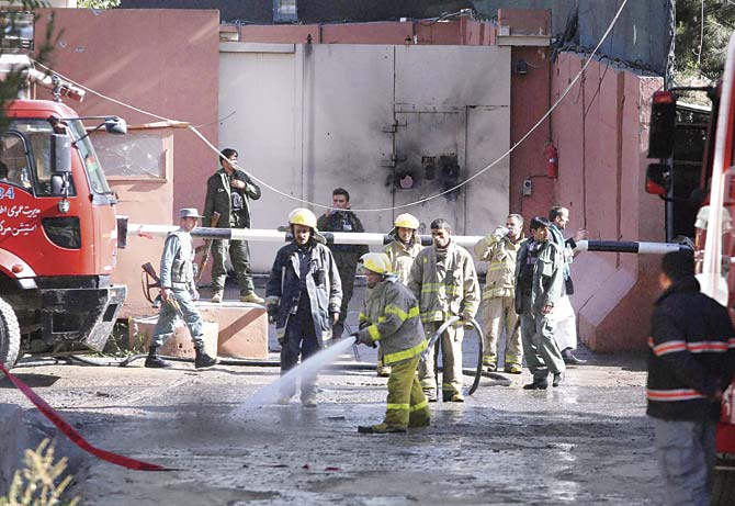 Afghan firefighters respond to a Taliban attack in Kabul, Afghanistan, on Wednesday. An all-night siege in an upscale neighbourhood of Afghanistan’s capital ended in the early hours yesterday morning. Pic/AP