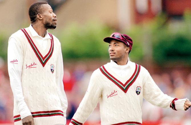 West Indies captain Brian Lara (right) talks to fast bowler Curtly Ambrose during the Leeds Test against England in 1995 