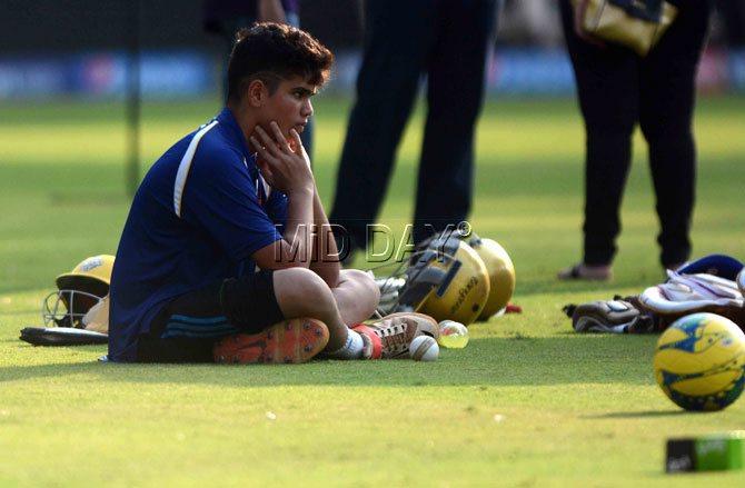 Arjun Tendulkar relaxes at Wankhede Stadium on Wednesday