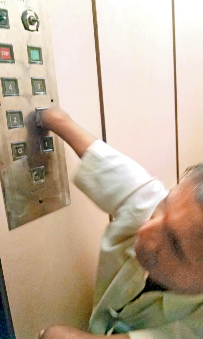 CAN AND ABLE: Jayshankar Shukla operates the lift at Nanabhay Chambers from 9am to 6pm
