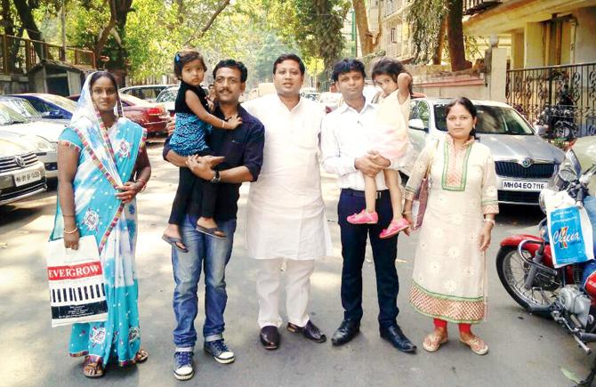 Priya (second from left) with her parents and another family whose child has suffered the same fate