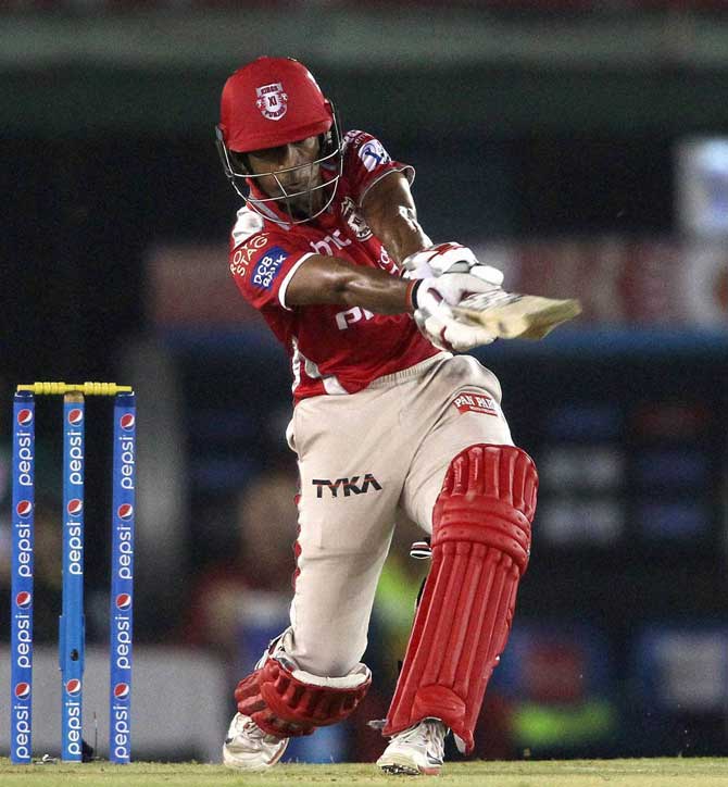Wriddhiman Saha of the Kings X1 Punjab plays a shot during IPL 8 match against Royal Challengers Bangalore in Mohali