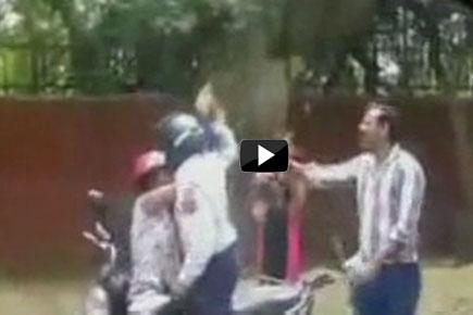 Caught on Camera: Delhi traffic cop sacked for hitting woman with brick