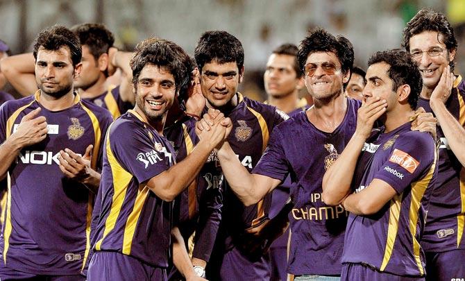 With the players of his IPL team, Kolkata Knight Riders
