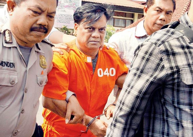 Chhota Rajan is brought out from a holding cell at the Bali police headquarters on November 2. According to sources, he was prepared for his arrest and did not seem surprised when the authorities came for him. Pic/AFP