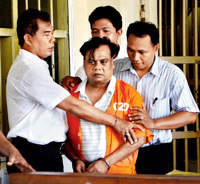 Chhota Rajan being brought out from a holding cell at the Bali police headquarters in Denpasar, Indonesia on November 2. Pic/AFP