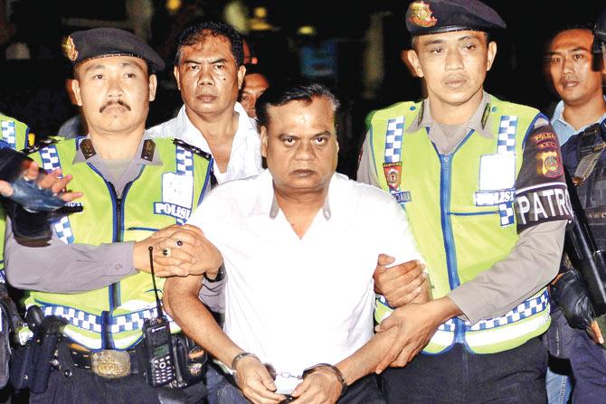 Indonesian police escorted Chhota Rajan from Bali police headquarters to the airport on November 5. pic/afp