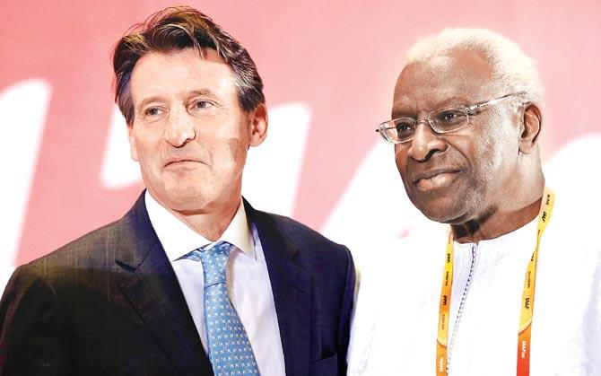 In happier times: IAAF president Lord Sebastian Coe stands with former president Lamine Diack during the 50th IAAF Congress in Beijing earlier this year. Diack is accused of having received over a million dollars from Russian authorities to cover up positive doping tests of their athletes. Pic/Getty Images