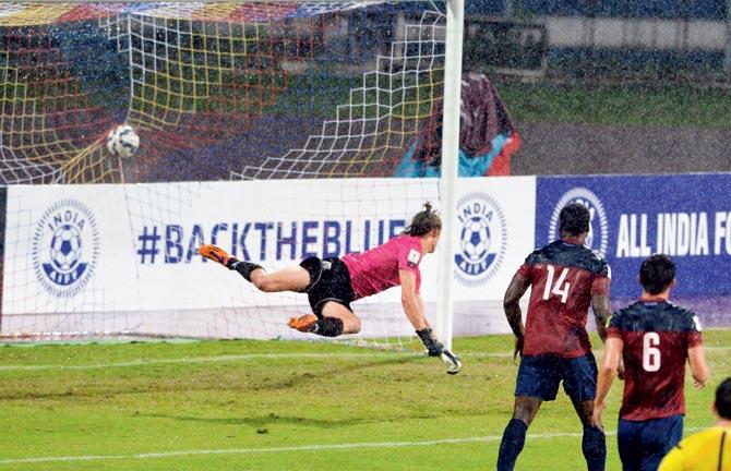 Guam goalkeeper Douglas Herrick (left) resulting in a goal for the hosts during their FIFA World Cup 2018 qualifier at the Sree Kanteerava Stadium in Bangalore on Thursday. Pics/AFP