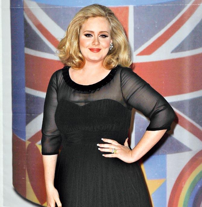 Singer Adele struggles to resist fame