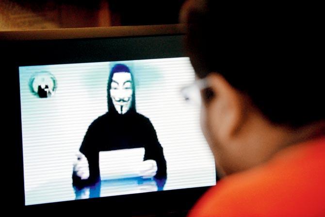 Cyber war: Anonymous vowed vengeance for attacks in Paris claimed by IS through their video.  Pic for representation/AFP