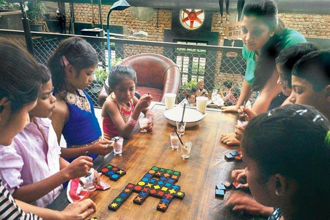 TOP CLASS: Kids from Hamara Footpath participate in tabletop gaming