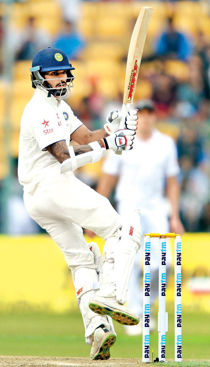 Shikhar Dhawan pulls on Day One of the second Test against South Africa in Bangalore on Saturday. PICS/AFP
