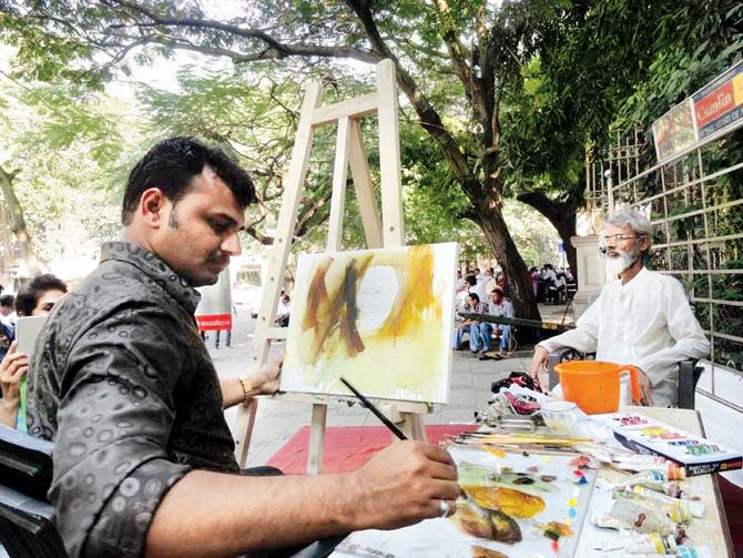 (Above) An artist working in the outdoors; (inset) the logo of the Bombay Art Society