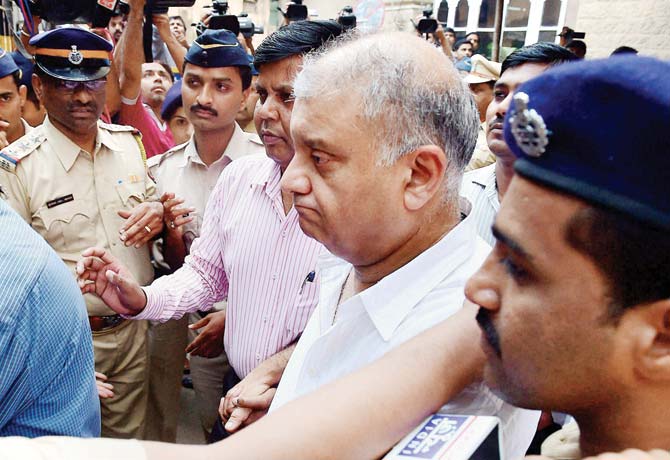 Peter Mukerjea being escorted to the Esplanade court by the CBI on Thursday. After the proceedings, he was taken back to New Delhi. Pic/PTI
