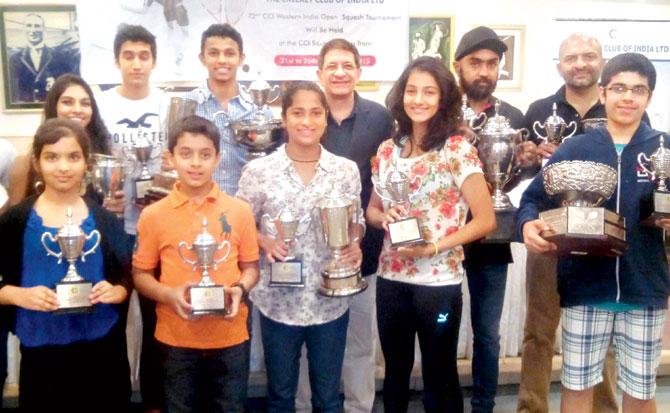 Winners of the CCI-Western India Open squash tournament with their trophies at the Cricket Club of India on Saturday